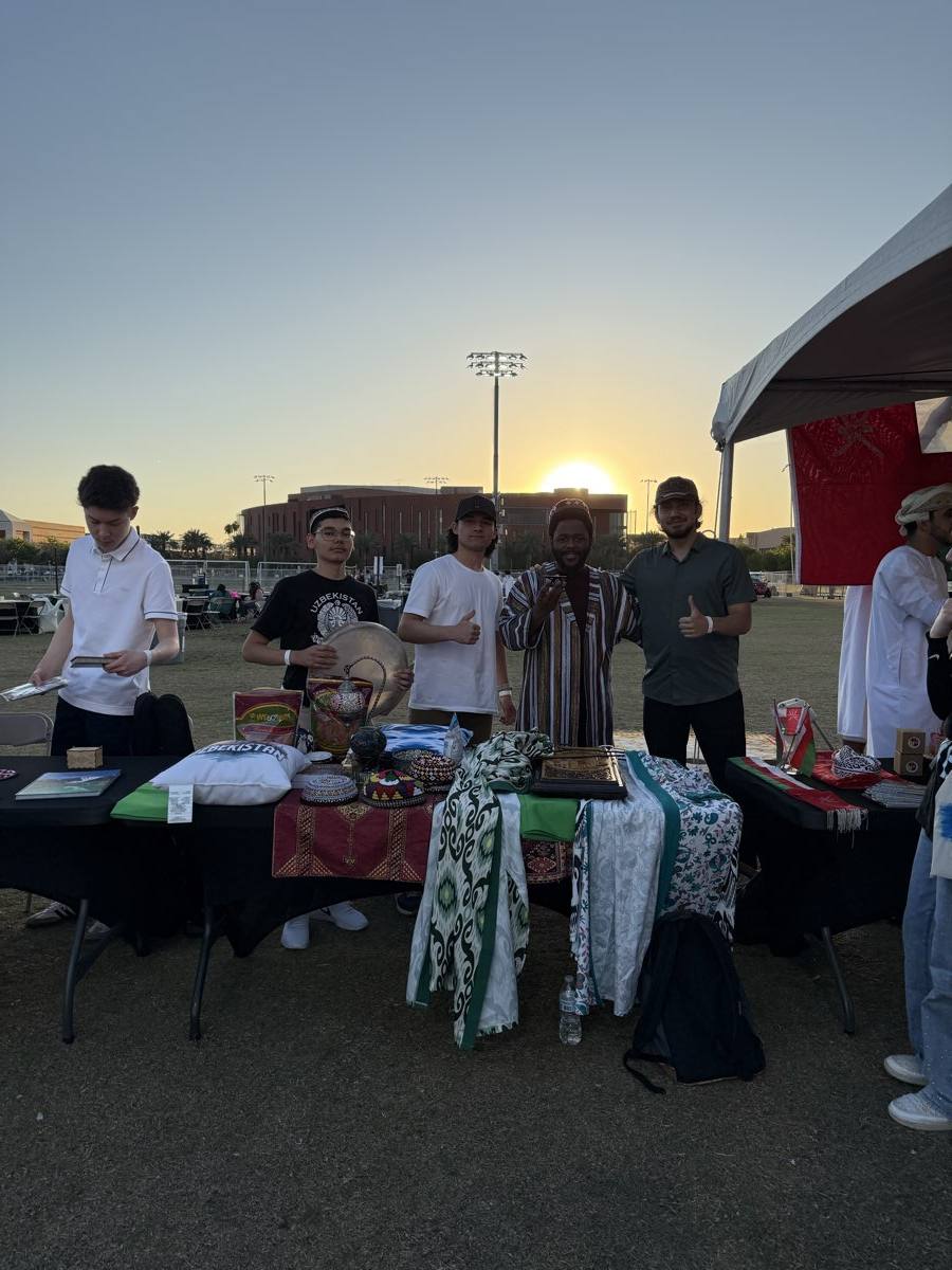 UZSA table at the 1001 Nights festival at sunset