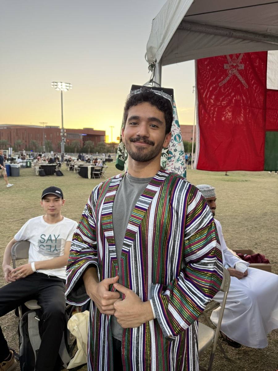 Student wearing a traditional Uzbek chapan